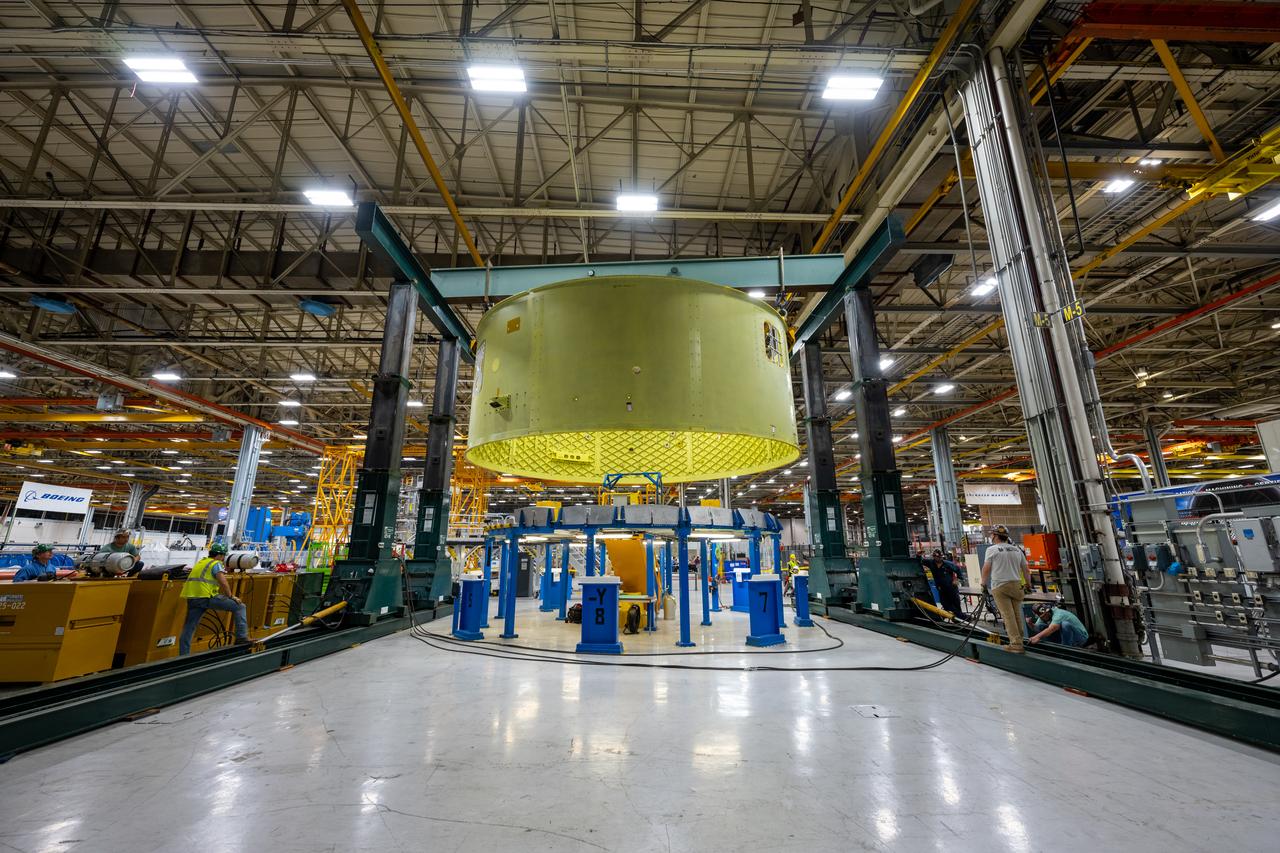 Crews at NASA’s Michoud Assembly Facility in New Orleans move the forward skirt of NASA’s Space Launch System (SLS) rocket to another part of the facility Dec. 15. Teams are preparing to apply the thermal protection system to the flight hardware, which will protect it from the extreme temperatures during launch and flight. The forward skirt is part of the core stage that will power the SLS rocket for the Artemis III mission. The forward skirt houses flight computers, cameras, and avionics.. The SLS core stage is made up of five unique elements: the forward skirt, liquid oxygen tank, intertank, liquid hydrogen tank, and the engine section. When fully stacked, the forward skirt is located at the top of the core stage and connects the stage to the upper part of the rocket. Together with its four RS-25 engines, the rocket’s massive 212-foot-tall core stage — the largest stage NASA has ever built — and its twin solid rocket boosters produce 8.8 million pounds of thrust to send NASA’s Orion spacecraft, astronauts and supplies beyond Earth’s orbit to the Moon and, ultimately, Mars. Offering more payload mass, volume capability and energy to speed missions through space, the SLS rocket, along with NASA’s Gateway in lunar orbit, the Human Landing System, and Orion spacecraft, is part of NASA’s backbone for deep space exploration and the Artemis lunar program. No other rocket is capable of carrying astronauts in Orion around the Moon in a single mission.